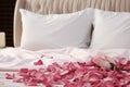 Hotel romance Bed adorned with rose petals creating a romantic setting