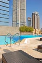 Hotel Rooftop Swimming Pool with Deckchair Royalty Free Stock Photo