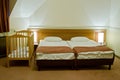 Hotel room with baby cot Royalty Free Stock Photo