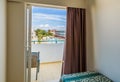 Hotel room with bed and view swimming pool Royalty Free Stock Photo