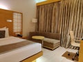 Luxury Hotel room with brown interior and velvet finish curtains