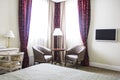 Hotel room in calm colours, sitting area, armchairs and window Royalty Free Stock Photo