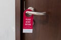 The hotel room with DO NOT DISTURB sign on the door. Royalty Free Stock Photo
