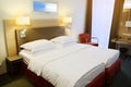 Hotel apartment room interior with bed. Royalty Free Stock Photo