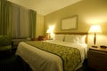 Hotel room with queen size bed Royalty Free Stock Photo