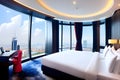 Hotel room in a skyscraper with large glass windows overlooking the city center. A romantic place full of love. Generative