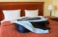 Hotel Room With Suitcase And Clothes