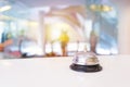 Hotel service bell on a table white glass Royalty Free Stock Photo