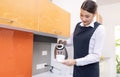 Hotel service concept. Chambermaid holding tray with cup of coffee