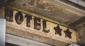 Hotel sign on a stone wall with two stars Royalty Free Stock Photo