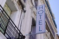 Hotel sign text blue in wall building facade in french tourist city Royalty Free Stock Photo