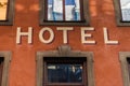 Hotel sign between windows