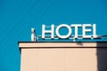 Hotel sign, word, icon, written on a rooftop of a building Royalty Free Stock Photo