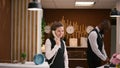 Hotel staff answers calls at reception Royalty Free Stock Photo