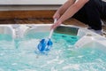 Hotel staff worker cleaning the hot tub