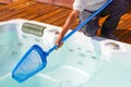 Hotel staff worker cleaning the pool. Maintenance