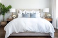 hotel-style bed with crisp, clean linens