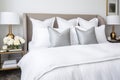 hotel-style bed with crisp white sheets Royalty Free Stock Photo