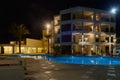 Hotel with a swimming pool at night on the shores of the Mediterranean Sea. Ayia Napa. Cyprus