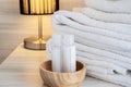 Hotel towel with shampoo and soap bottle set on white bed Royalty Free Stock Photo
