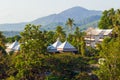 A hotel among trees on the island of Phuket. Architecture of Thailand