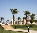 hotel in the United Arab Emirates, villas, palm trees, decorative columns, lawns, grass, palm trees and trees Royalty Free Stock Photo