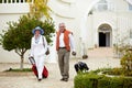 Hotel, vacation and elderly couple walking with suitcase in a holiday location happy in retirement and travel together Royalty Free Stock Photo