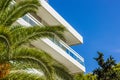 Hotel white front facade buildings and palm on south Mediterranean district Royalty Free Stock Photo