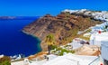 Hotels of Fira town on slopes of volcanic mountain overlooking sea and Caldera of Santorini, Greece. Royalty Free Stock Photo