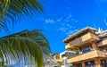 Hotels resorts buildings in paradise among palm trees Puerto Escondido