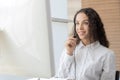 Hotline. happy young caucasian female call center customer support executive with headset working in office, education online, cus Royalty Free Stock Photo