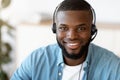 Hotline Support Service. Portrait Of Smiling African Customer Service Operator In Headset Royalty Free Stock Photo