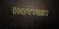 HOTTEST -Realistic Neon Sign on Brick Wall background - 3D rendered royalty free stock image