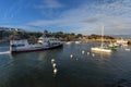 The passengers ferry arriving to Saint-Gildas-Houat Port in Houat Island as seen from the pier, the village building in the