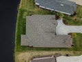 Houes and Screen Porches Line the Bank of a Small Pond in an American Neighborhood from Above Aerial