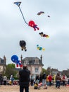 Houlgate, France May 2023. Kite festival in the sky cartoon characters, mickey mouse, donald duck, super man, spiderman, beach