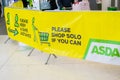HOUNSLOW, LONDON, ENGLAND- 5th February 2021: Social distancing and `please shop solo if you can` banner in ASDA in Hounslow ami