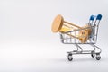 Hourglass in shopping cart on white background