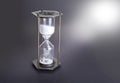 Hourglass as time passing concept for business deadline, urgency and running out of time Royalty Free Stock Photo