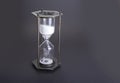 Hourglass as time passing concept for business deadline, urgency and running out of time Royalty Free Stock Photo