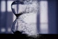 Hourglass as time passing and pass away concept. Royalty Free Stock Photo