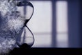 Hourglass as time passing and pass away concept. Royalty Free Stock Photo