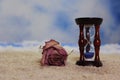Hourglass on Beach With Dried Pink Rose Royalty Free Stock Photo