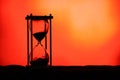 Hourglass Black Silhouette Orange Yellow Gradient Backgroud Passage of Time Royalty Free Stock Photo