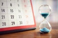 Hourglass and calendar Royalty Free Stock Photo