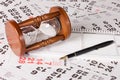 Hourglass on calendar sheets Royalty Free Stock Photo