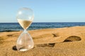 Hourglass Clock on the Sand Beach