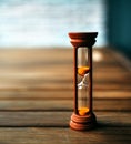 Hourglass closeup stand on a wooden floor Royalty Free Stock Photo