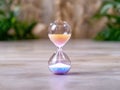 Hourglass with colorful sand flowing