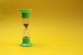 Hourglass stand on a yellow background